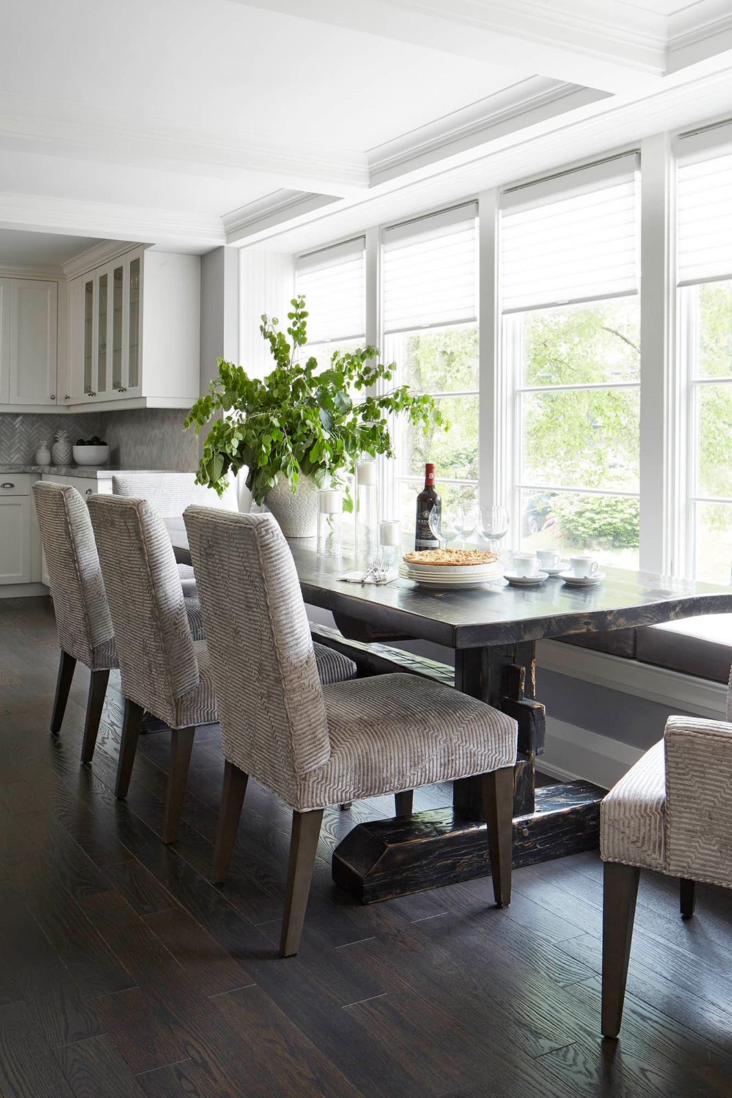 NUITH – FIFTY SHADES OF DIOR GRAY – KITCHEN DINING DESIGNED BY CELIA ALIDA RUTTE – PHOTOS BY DONNA GRIFFITH Kitchen dining designed in shades of purple grey with a large dining table in front of a window bench and five dining chairs.
