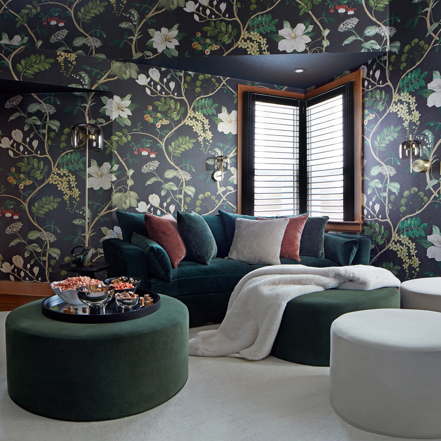 A photo of a colourful media room fades out to a quote that reads “To us our house was not unsentient matter–it had a heart and a soul and eyes to see us with, and approvals and solicitudes and deep sympathies; it was of us, and we were in its confidence, and lived in its grace and in the peace of its benediction.”